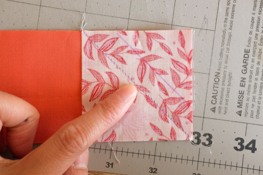 example of marked guideline with a square piece of fabric with stitch diagonally